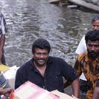 R. Parthiepan - Parthiban doing Flood Relief Activities Gallery