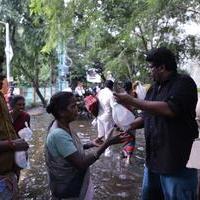 Parthiban doing Flood Relief Activities Gallery