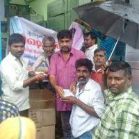Vishal provides Rice Lunch and Financial assistance to people affected by flood through his fans club Stills | Picture 1160799