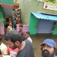 Hero Vishal supplying food packets and Water Photos