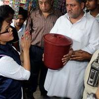 Rakhi Sawant distributes dustbins to needy people Stills