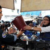 Rakhi Sawant - Rakhi Sawant distributes dustbins to needy people Stills