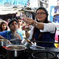 Rakhi Sawant - Rakhi Sawant distributes dustbins to needy people Stills